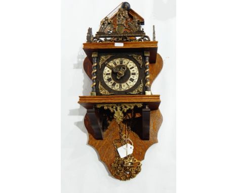 A bracket clock with oak case and elaborate brasswork decoration, twin train striking movement, height 61cm together with a p