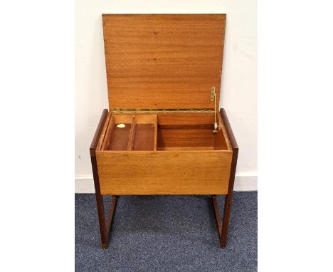 MID CENTIRY TEAK SEWING BOXthe hinged top opening to reveal a lift out two compartment shelf, 52cm x 48.2cm x 37.5cm 