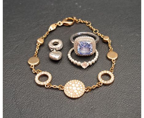 SELECTION OF FASHION JEWELLERY comprising a Swarovski crystal cocktail ring, a Pandora silver ring and dangle charm, and a Fo