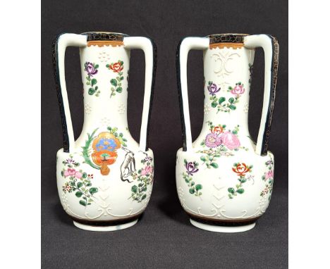 PAIR OF CHINESE EXPORT STYLE TRIPLE HANDLED VASESthe bodies with flowers, white enamel decoration and crest with dog on each,
