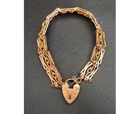 NINE CARAT ROSE GOLD FANCY LINK GATE STYLE BRACELETwith nine carat gold heart padlock clasp and safety chain, approximately 2