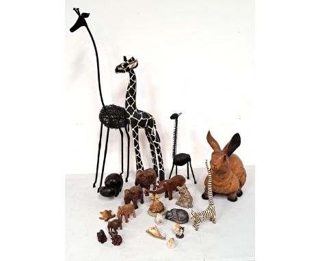 LARGE QUANTITY OF WOODEN, METAL AND CERAMIC ANIMALSincluding metal giraffes, large wooden rabbit, elephants, ceramic cats, et