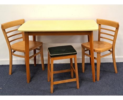 RETRO FORMICA TOPPED TABLE BY CENTAwith yellow Revelite (Formica) top raised on beech supports, label to underside; together 