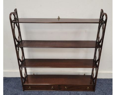 MAHOGANY WALL MOUNTING SHELF UNITthe four shelves above two drawers and flanked by pierced sides, 81cm x 88cm x 17cm 