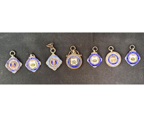 SIX SILVER 1920s DERBY/DERBYSHIRE ENAMEL DECORATED SILVER MEDAL FOBScomprising three Derby Schools Athletic Association medal