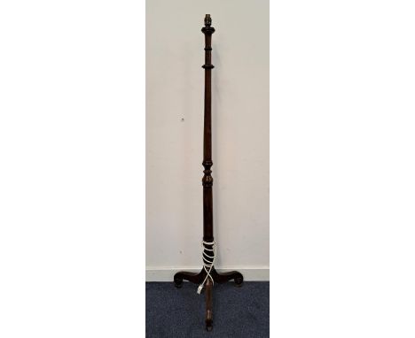 MAHOGANY STANDARD LAMP the turned column raised on three legs with scroll feet below acanthus leaf detail, 153.5cm (excluding