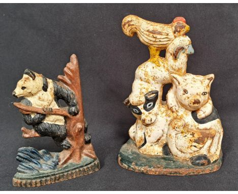 VINTAGE CAST IRON DOOR STOPSone of a Panda, 16cm, the other of farmyard animals, 23cm high (2) 