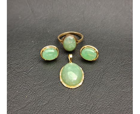 SUITE OF JADE SET JEWELLERYcomprising a ring in nine carat gold and a pair of earrings and pendant in fourteen carat gold, al