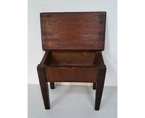 VINTAGE STAINED PINE WORKBOX ON LEGSin the style of a desk, with tapering legs and lift up top, 35 x 30 x24cm 