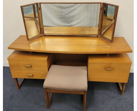 MID CENTURY G-PLAN TEAK QUADRILLE DRESSING TABLE  the hinged triptych mirror above a floating shelf with curved front, the ce