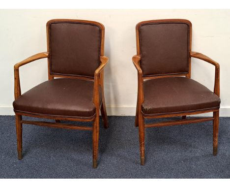 PAIR OF MID CENTURY TEAK ARM CHAIRSthe fluted legs with brass end, with curved arms and brown leatherette seats, together wit