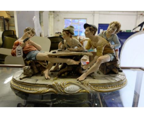 A large Capodimonte figure group The Cheats, 4 boys playing cards at table marked Tiche, length 56cm height 28cm