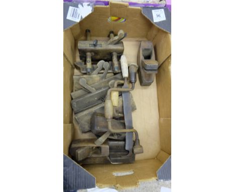 A collection of vintage woodworking tools to include braces, planes, etc 