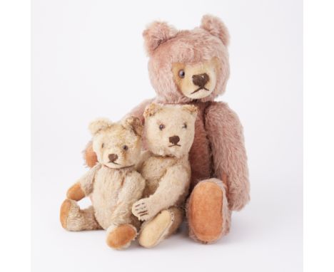 Three vintage teddy bears probably by Steiff one with pink mohair.