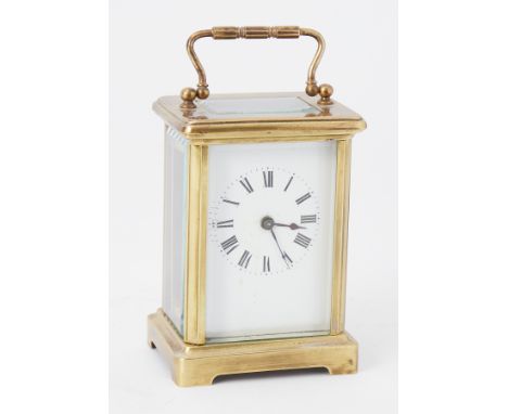 Small French carriage clock with platform escapement and key, height 15cm handle up.