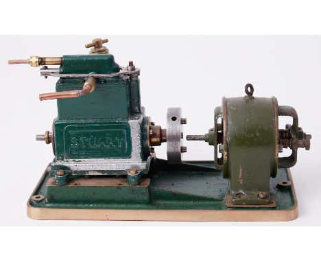 A Stuart steam engine and generator, 5" high and 8" long.