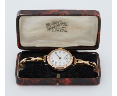 An antique 9ct yellow gold manual wind wristwatch, hallmarked inside backplate and on a 9ct yellow gold stretch bracelet, com