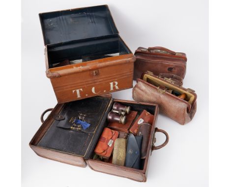 Two gladstone bags, tin trunk and a leather 19th century travel case by Insall, Bristol, all containing various items includi
