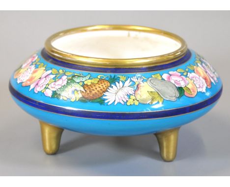 19th Century circular bowl on three gilded feet, the border raised with fruits and foliage,  by Minton. designed by Christoph