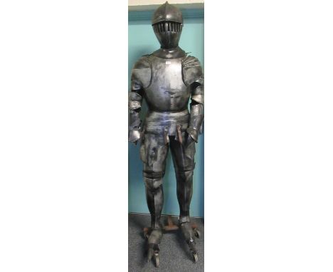 Metal finish theatrical full size model of a knight on metal base with wheels, standing approx 210cm high. (B.P. 21% + VAT)Th