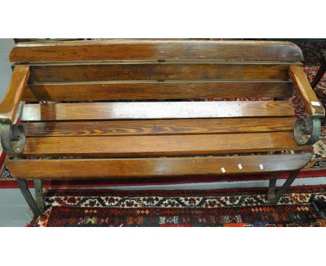 Heavy pitch pine garden bench with cast iron frame.  (B.P. 21% + VAT) 