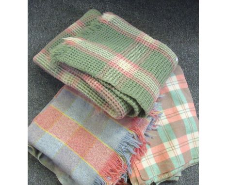 Box containing three check vintage woollen blankets or carthen, one with a 'Derw Product Welsh Woollens' label, another red a