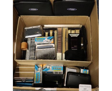 Box of oddments to include: 'Zippo lighter', various watch straps, 'Rizla' rolling machines etc.  (B.P. 21% + VAT) 