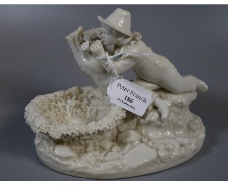 Victorian Royal Worcester Blanc De Chine 'Kate Greenaway' figurine or trinket bowl of a boy playing a pipe. Puce painted and 