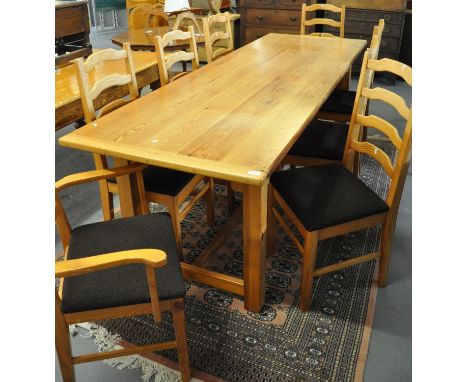 Modern pine kitchen table. 246x82x78cm approx. Together with a set of eight pine ladder back dining chairs, to include two ca