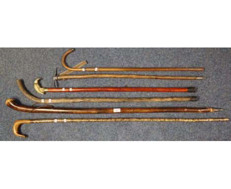Collection of vintage walking sticks, together with an ice axe.  (6)  (B.P. 21% + VAT) 
