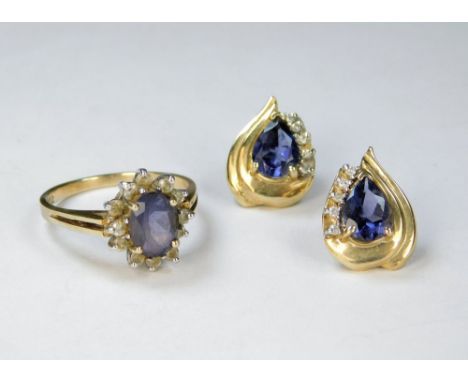 IOLITE RING ETC. A 10kt. iolite &amp; diamond cluster ring &amp; a similar pair of 10kt iolite &amp; diamond earrings.