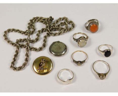 SILVER. A Chinese silver ring set with carnelian, five other silver rings, a silver locket etc.