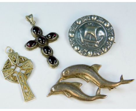 SILVER. A sterling silver cast Viking boat brooch, diameter 3.5cm, a cabouchon garnet silver cross, a silver Celtic cross &am