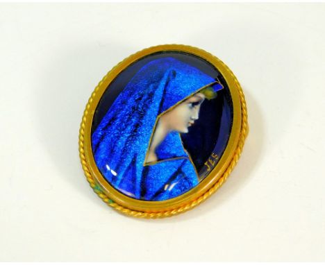 ENAMELLED BROOCH. A hand painted enamel brooch, initialled J E S, set in continental brass mount. 3.7 x 3cm.