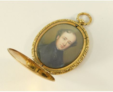 PORTRAIT MINIATURE.An ornate yellow metal, engine turned locket, the hinged cover opening to reveal a well painted portrait o