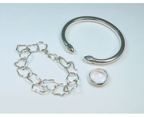 SILVER. An 800 standard silver torque bangle (tested), a modern hand made bracelet &amp; silver ring.
