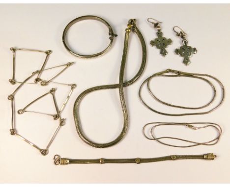 SILVER JEWELLERY.A modern hand made silver necklace, a hinged silver bangle, three ethnic chain necklaces etc. 