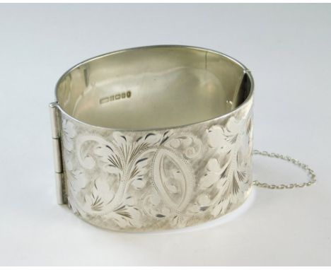 SILVER BANGLE. A Victorian style silver cuff bangle, depth 3.7cm. Approx. 3½oz.