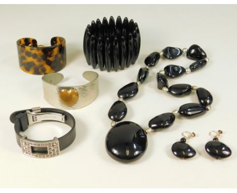 COSTUME JEWELLERY. Costume jewellery including a St. Justin bangle, a faux tortoiseshell bangle &amp; a collection of black j