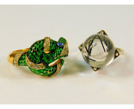 TRIFARI ETC. A Trifari gilt metal, enamelled & paste set serpent ring & a Swedish silver rutilated quartz ring. 