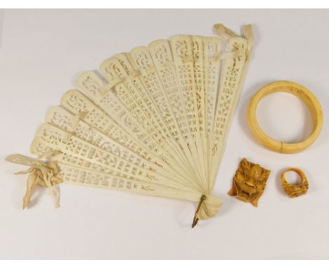 COSTUME JEWELLERY ETC. A late 19thc ivory bangle, two oriental composition pieces &amp; a bone fan (a.f.).