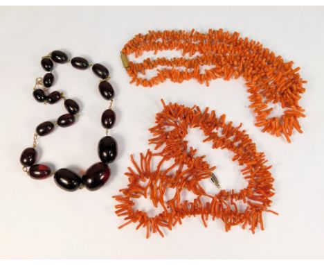 BAKELITE &amp; CORAL. A cherry red bakelite bead necklace &amp; two stick coral necklaces.