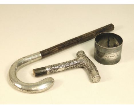 NAPKIN RING ETC. An engine turned napkin ring &amp; two silver mounted parasol handles.
