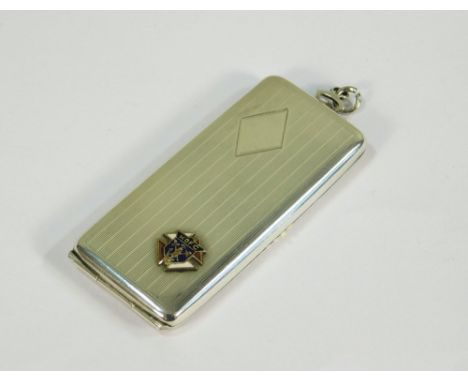 STAMPS CASE. An American engine turned, sterling silver stamps case by E.A.M. The front with an enamelled emblem for the Knig