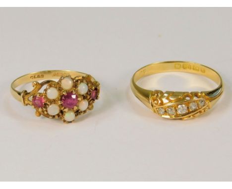 DRESS RINGS. A 9t. gold, opal &amp; ruby dress ring &amp; an Edwardian 18ct. gold, five stone diamond ring.