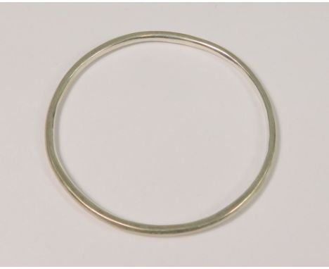 BREON O'CASEY. A plain silver bangle by Breon O'Casey. Stamped with maker's mark BOC &amp; hallmarked for Birmingham 1975.