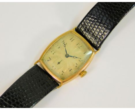GOLD WATCH. A gentleman's 9ct. gold cased wrist watch with engine turned dial. Case, 3 x 2.4cm.Please note: We cannot guarant