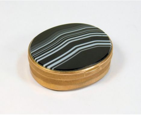 SNUFF BOX. A brass mounted snuff box with banded agate base &amp; lid, width 6cm.