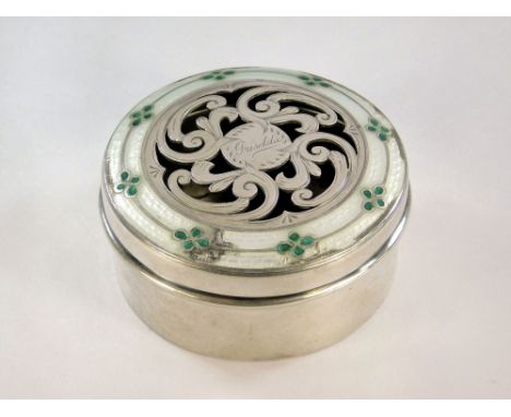 ENAMELLED BOX. A silver box with pierced lid engraved 'Griselda' to the centre & with an enamelled border. (some enamel a.f.)