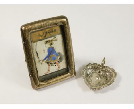 SILVER FRAME ETC. An Edwardian miniature silver photograph frame &amp; a miniature chamber stick. Frame 8 x 5.5cm.